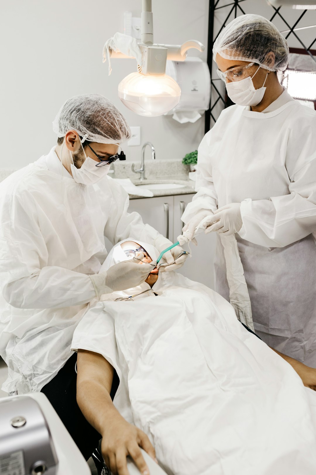 woman-in-white-scrub-suit-holding-white-and-green-hose-hl6ug9chw5a